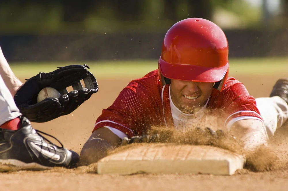Baseball And Softball Team Names That Hit It Out Of The Park, Player sliding stealing a base